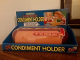 Talking hot dog condiment holder