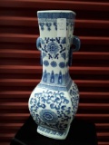 Very tall blue and white porcelain handled vase, flowers,