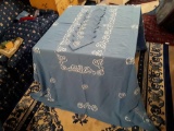 Delicate blue and white tablecloth with matching napkins