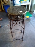 Heavy metal with stone top plant stand