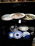 Lot of decorative plates and items. Includes blue and white