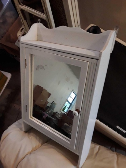 Cute white mirrored cupboard with towel bar