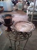 Silver colored tray and handled urn