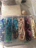 6 compartment storage box full of necklaces. Glass, shell, stone and plastic