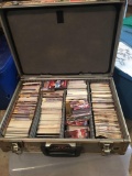 Nice hard metal storage case full of racing cards.