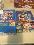 Two boxes of unopened football cards