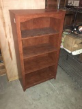 Medium brown wood laminate bookshelf