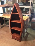 Unique canoe shaped shelf with bamboo finish