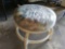 Short Round footstool, pad is still wrapped in plastic