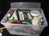 Container with Shimmering Holiday Decor Including Tinsel and Holiday Evergreenery