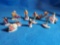 10 Christmas holiday village resin accessories including clergy, and scenes