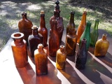 beautiful old bottles including Browns and greens