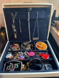 Jewelry box with contents including lots of Elvis related jewelry