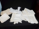 Vintage linen tablecloth grouping including rectangle tablecloth napkin sets, comma crochet Doilies
