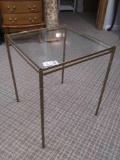short metal glass and golden table