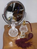 Vanity Grouping: Perfume and Mirror and Bottles