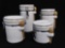 (4) White Ceramic Graduated Canisters with Wooden Spoons