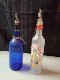 Vintage liquor bottles with golf theme stoppers Including cobalt blue and Kremlyovskaya vodka