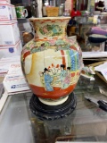 Beautiful painted porcelain Oriental vase damaged with wooden stand