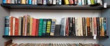 Book shelf grouping including vintage, Readers Digest, Irving Wallace, and more