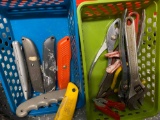 Two small baskets full of tools Wrenches and razor knives