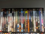 Large lot of hit DVDs in cases