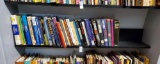 Book shelf grouping including Julie Andrews, Miley Cyrus, Cooking, education, finance