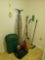 large grouping of cleaning, house care supplies including brooms,trash can