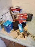Bathroom medical grouping including Blood pressure, glucose monitors, various scissors, and more