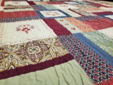 Patchwork quilt appears handcrafted , clean!