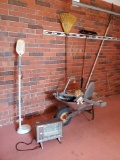 Garage grouping including electric heater, OTT light, yard tools