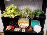 grouping of decor, artificial floral, inspirational signage, wax melts, candles