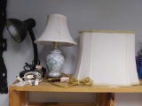 Trio of lighted items including desk lamp and extra shade