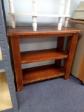 small reddish wood petite table with shelf