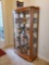 Bow Front Blonde Oak 4 shelf curio cabinet, lighted and mirrored