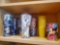 Shelf grouping of (5) large Royal Caribbean Coca-Cola insulated tumblers