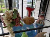 Shelf grouping including grape decor, lighthouse and lightweight vase bottle decor