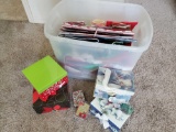 Storage bin full of Christmas boxes, wrappings, bags and more