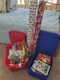 Bins of Christmas wrappings and cards including Disney paper, cards, Bows and more