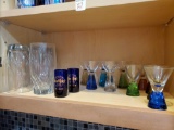 Glass grouping including colorful cordials, Hard Rock Shots, and tumblers