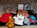 Hot pad/mitts and trivet grouping including vintage, Mickey Mouse and calphalon