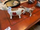 2 Vintage hand painted Cow creamers including large Poconos advertising