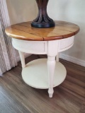 Wood and cream round end table with woven accent