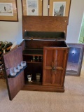 Hefty Solid Wood , rolling HIDDEN LIQUOR CABINET with contents , vintage
