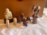 8 carved mini figures including wood and bone or ivory