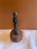 Tiny bronze metal sculpture of woman and child praying on stone base