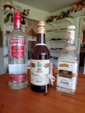 Trio of (opened) bottles with contents