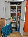Contents of cabinet including cleaning, car care, brushes, folding chaise