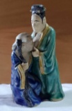 Highly Collectible Chinese MUDMAN figurine, marked CHINA