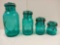 FOUR GRADUATED AQUA / TURQUOISE BALL EAGLE METAL CLASP GLASS BOTTLES